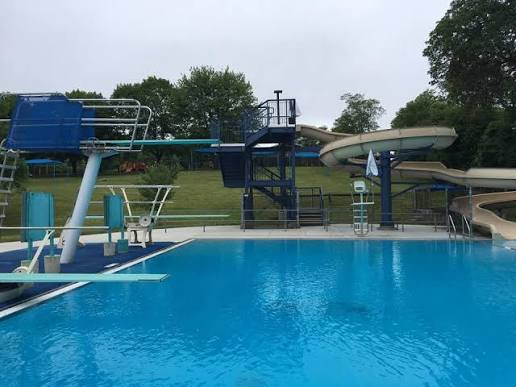 Germonds Pool with diving boards and a waterslide